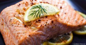 Wild-caught salmon fillet with rosemary garnish